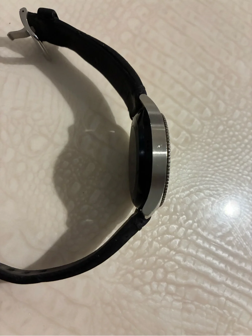 Samsung Silver Smartwatch with Black Strap and Blue Display